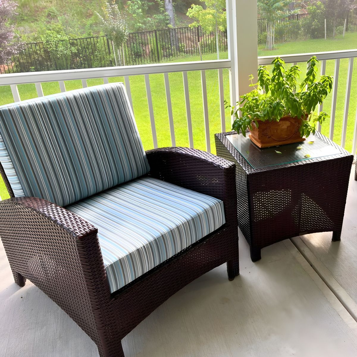 Custom outdoor chair cushion made with blue striped Sunbrella fabric