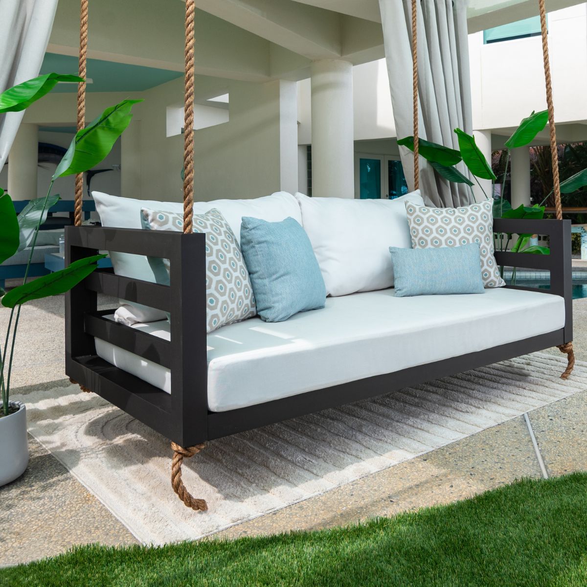 Outdoor swing bed with white custom cushions