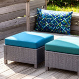 Outdoor ottoman with blue cushions 
