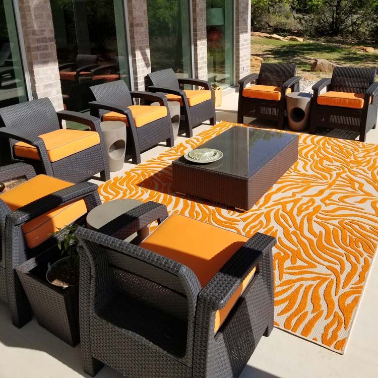 Orange custom outdoor chair cushions made with Sunbrella Fabric