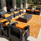 Orange custom outdoor chair cushions made with Sunbrella Fabric