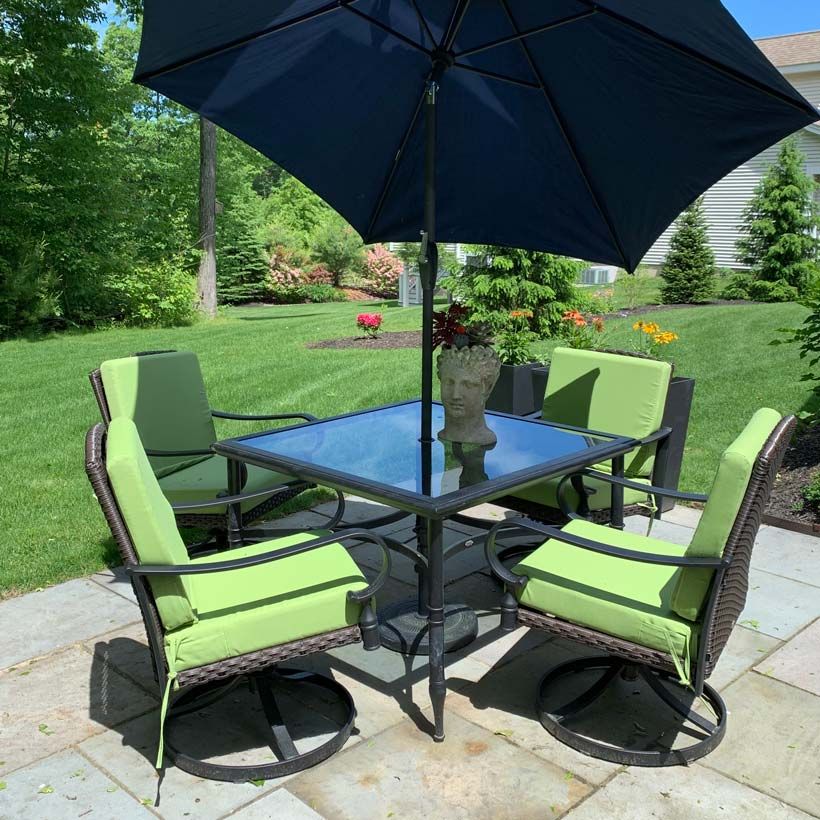 Set of green patio chair cushions made with Sunbrella fabric
