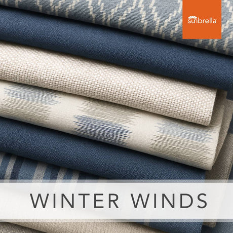 Navy, light blue, and taupe Sunbrella fabric samples for outdoor cushions and drapery.